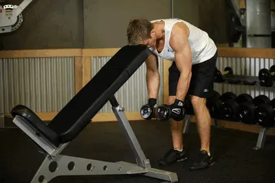 Animation of Bent Over Dumbbell Rear Delt Raise With Head On Bench